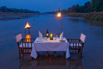 Romantic dinner in the river on the South Luangwa, Zambia