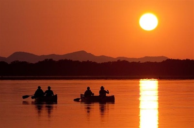 Canoeing at sunset on the Zambezi River, Lower Zambezi National Park, Zambia